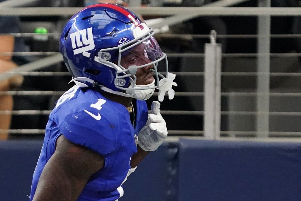 New York Giants wide receiver Malik Nabers (1) reacts after scoring a touchdown during the fourth quarter at AT&T Stadium.