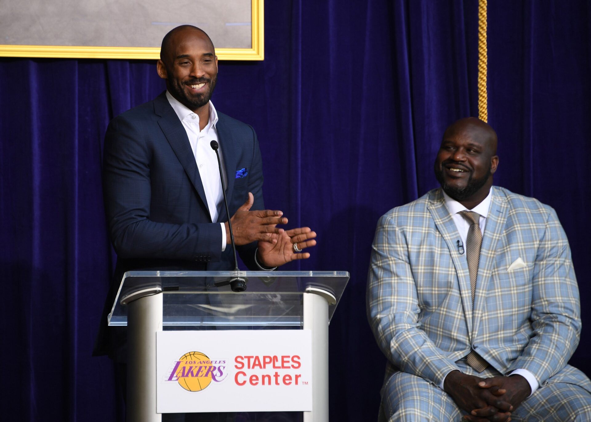 Kobe Bryant (left) speaks during ceremony to unveil statue of Los Angeles Lakers former center Shaquille O'Neal at Staples Center.