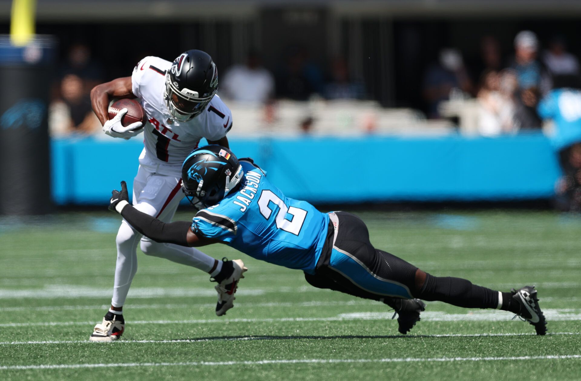Atlanta Falcons wide receiver Darnell Mooney (1) runs the ball with Carolina Panthers cornerback Mike Jackson (2) defending during the first half at Bank of America Stadium.