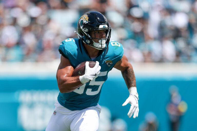 Jacksonville Jaguars tight end Brenton Strange (85) runs with the ball against the Carolina Panthers in the first quarter at EverBank Stadium.