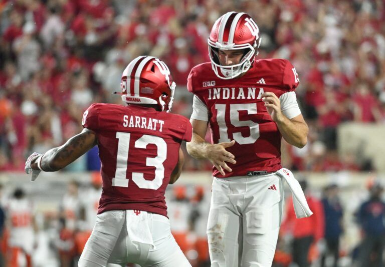 Indiana Hoosiers wide receiver Elijah Sarratt (13) and IIndiana Hoosiers quarterback Fernando Mendoza (15) celebrate after a touchdown during the second half against the Illinois Fighting Illini at Memorial Stadium.