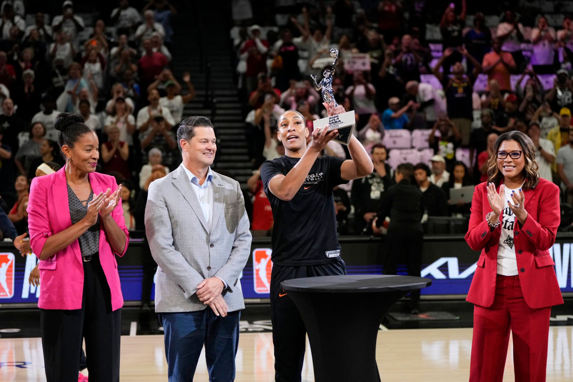 Las Vegas Aces center A'ja Wilson (22) receives the 2025 WNBA Most Valuable Player award prior to game one of the second round for the 2025 WNBA Playoffs at Michelob Ultra Arena.