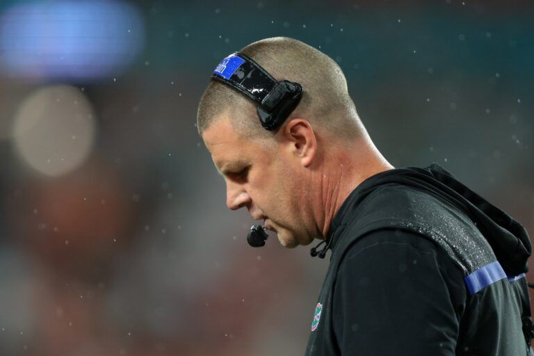 Florida Gators head coach Billy Napier looks down against the Florida Gators during the first quarter at Hard Rock Stadium.