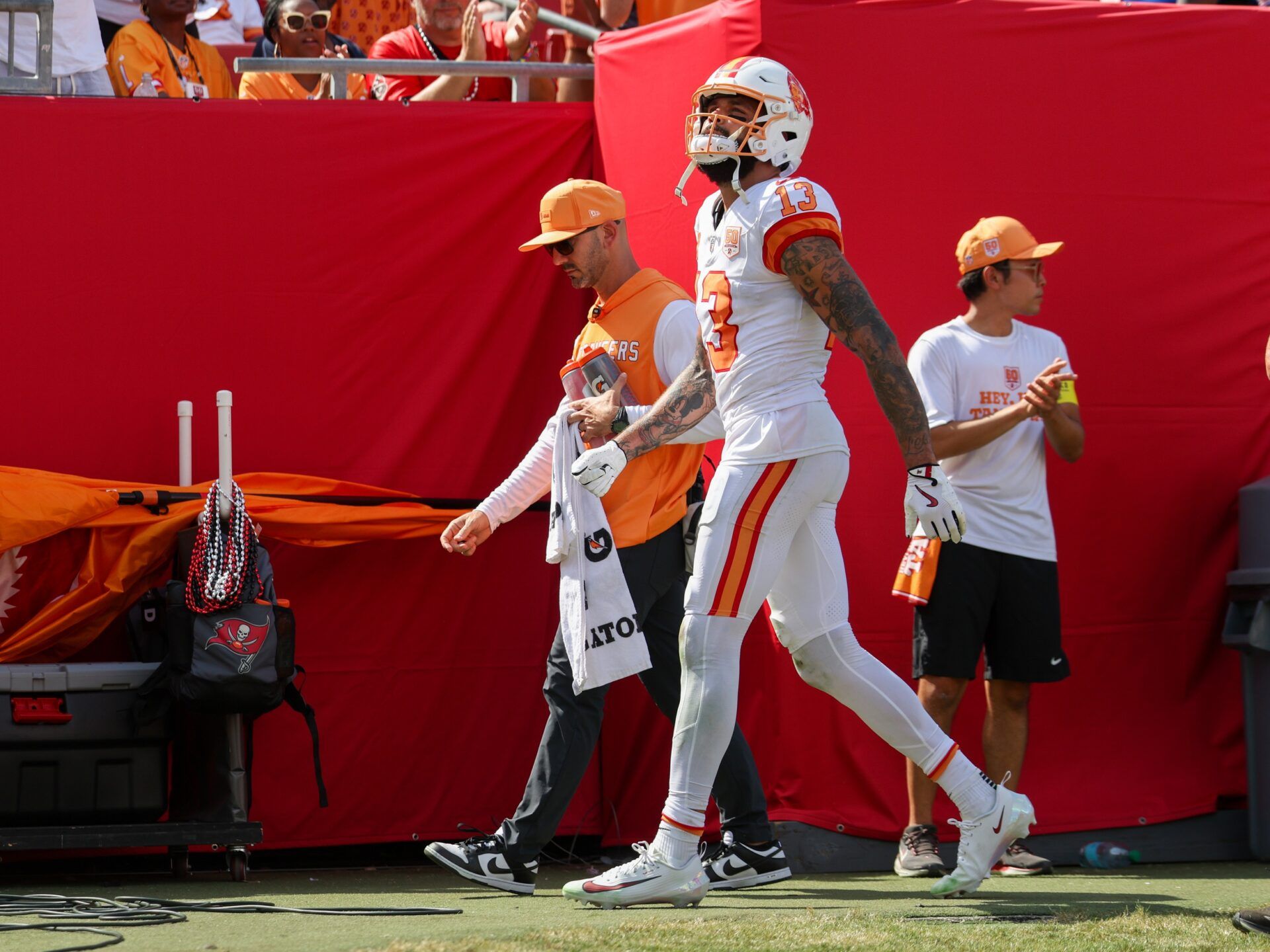 Tampa Bay Buccaneers wide receiver Mike Evans (13) walks to the locker room against the New York Jets in the fourth quarter at Raymond James Stadium.