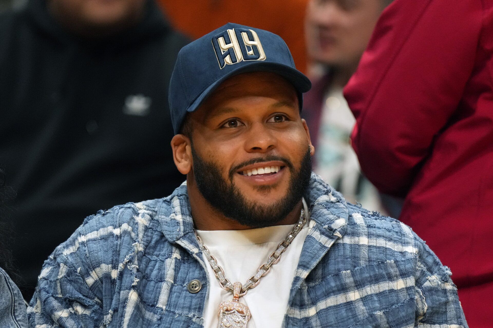 Los Angeles Rams defensive end Aaron Donald reacts during the second half of the game between the LA Sparks and the Las Vegas Aces at Crypto.com Arena.