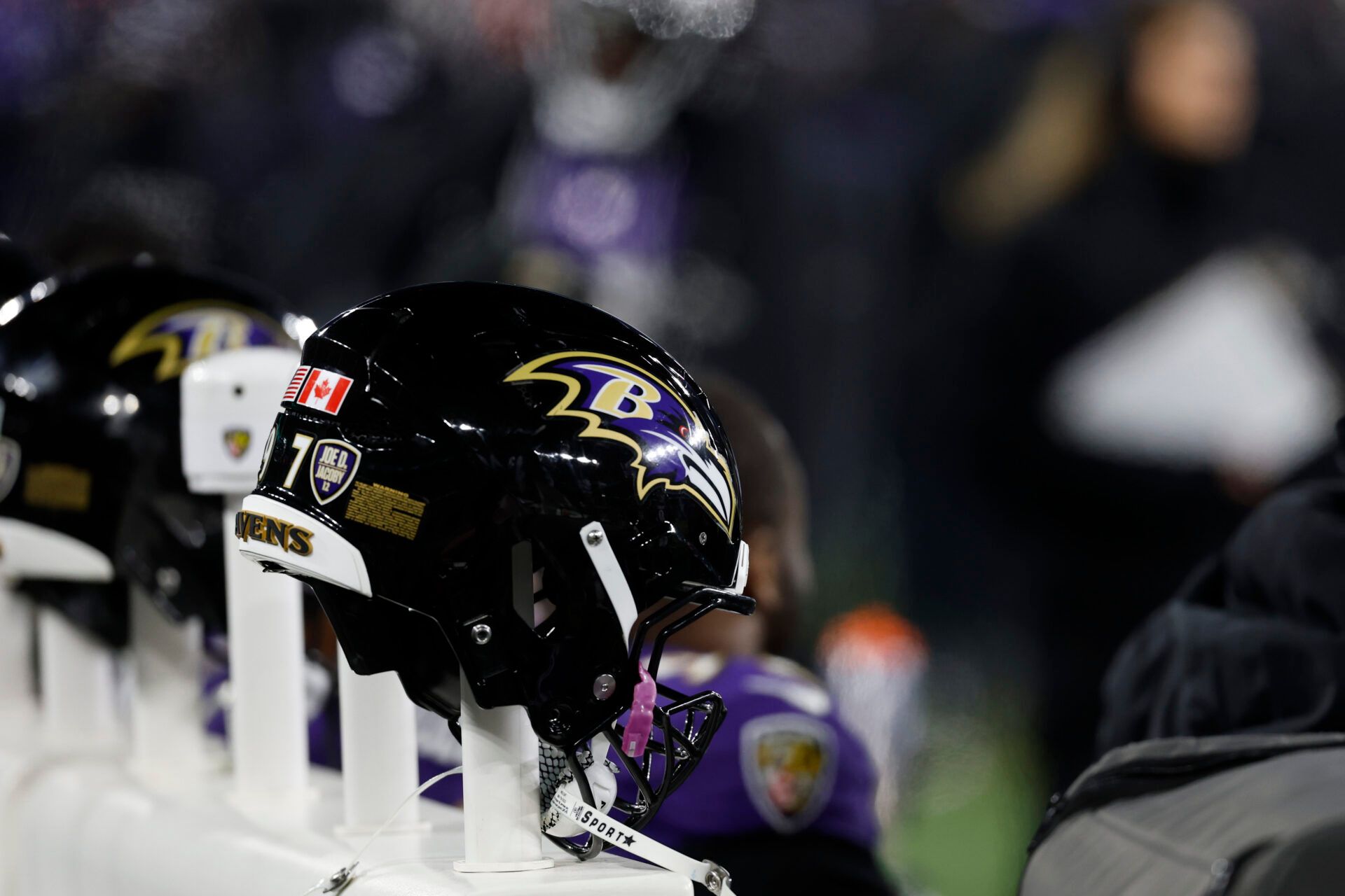 A view of Baltimore Ravens players' helmets on a heated bench against the Pittsburgh Steelers in an AFC wild card game at M&T Bank Stadium.