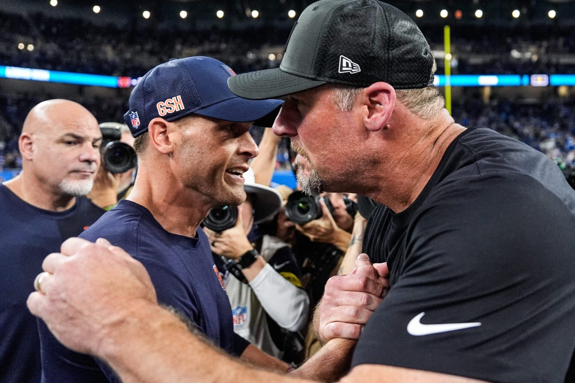 Detroit Lions head coach Dan Campbell, right, shakes hands with Chicago Bears head coach Ben Johnson after 52-21 win over the Bears at Ford Field in Detroit on Sunday, Sept. 14, 2025.