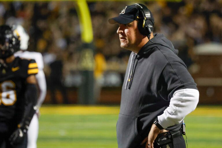 Appalachian State Mountaineers head coach Shawn Clark waits on the official call during the second quarter against the South Alabama Jaguars at Kidd Brewer Stadium.