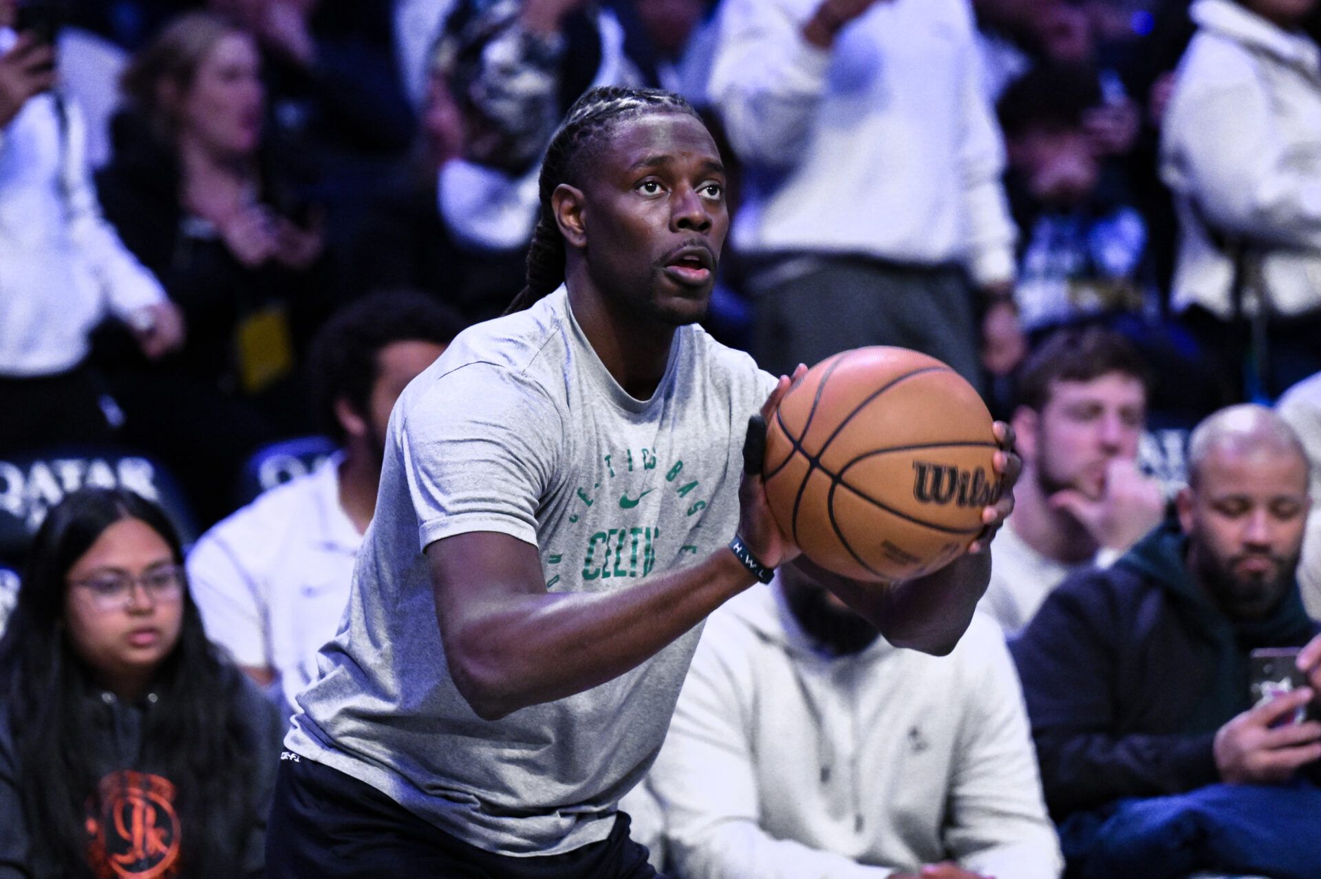 Boston Celtics guard Jrue Holiday (4) warms up before a game against the Brooklyn Nets at Barclays Center.