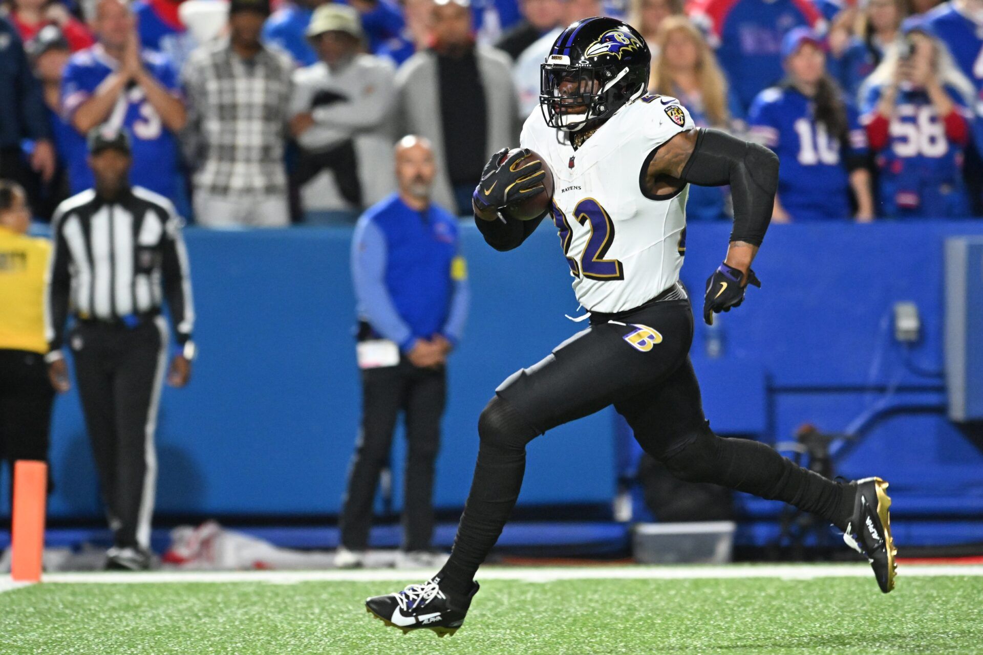 Baltimore Ravens running back Derrick Henry (22) runs with the ball for a touchdown against the Buffalo Bills during the first half at Highmark Stadium.