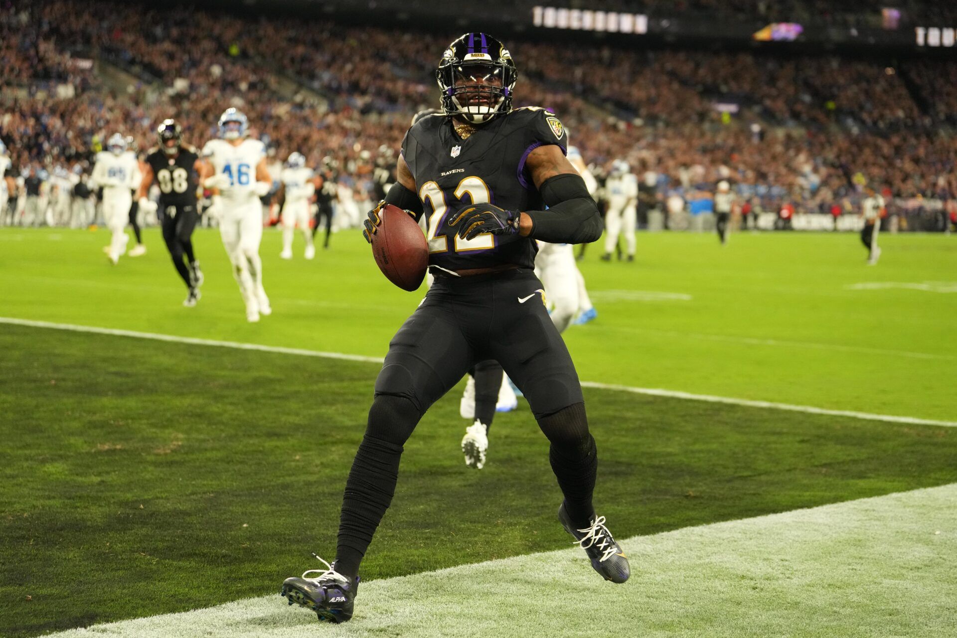 Baltimore Ravens running back Derrick Henry (22) rushes for a touchdown against the Detroit Lions during the first half at M&T Bank Stadium.