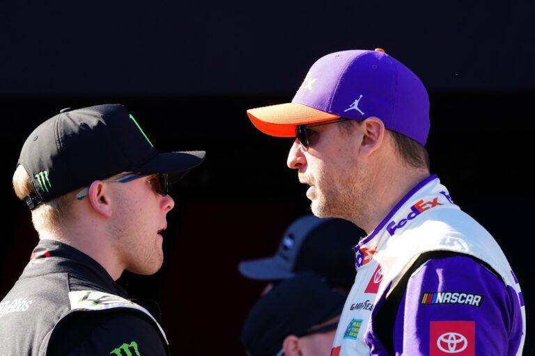 NASCAR Cup Series driver Denny Hamlin (11) and driver Ty Gibbs (54) talk during driver introductions before the Daytona 500 at Daytona International Speedway.