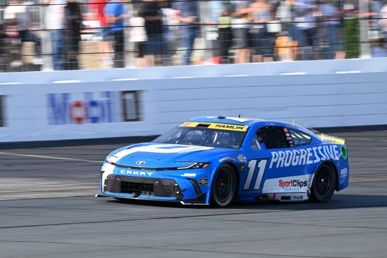NASCAR Cup Series driver Denny Hamlin (11) races in the Mobil 1 301 at New Hampshire Motor Speedway.