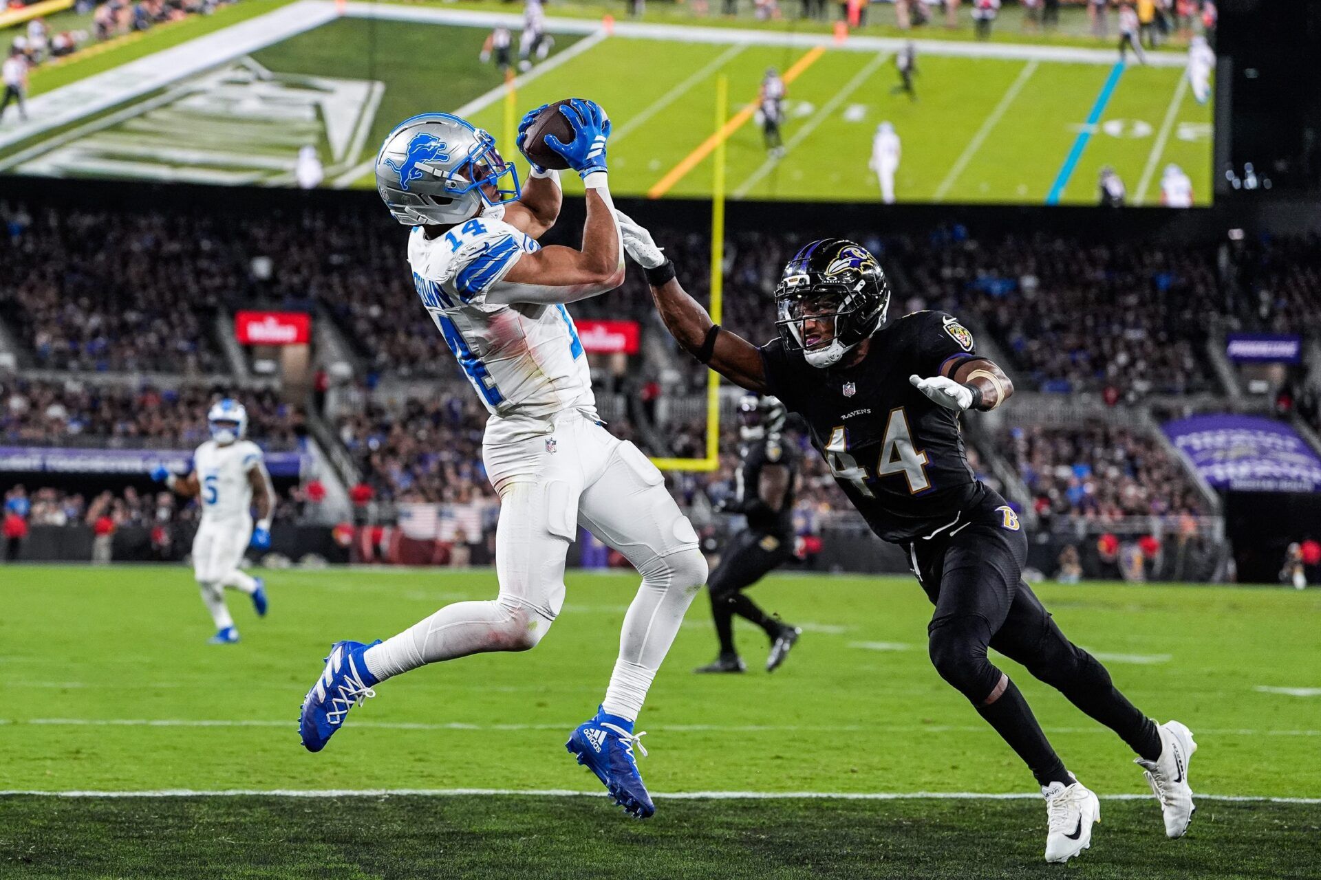 Detroit Lions wide receiver Amon-Ra St. Brown (14) makes a catch for a touchdown against Baltimore Ravens cornerback Marlon Humphrey (44) during the second half at M&T Bank Stadium in Baltimore, Md. on Monday, Sept. 22, 2025.