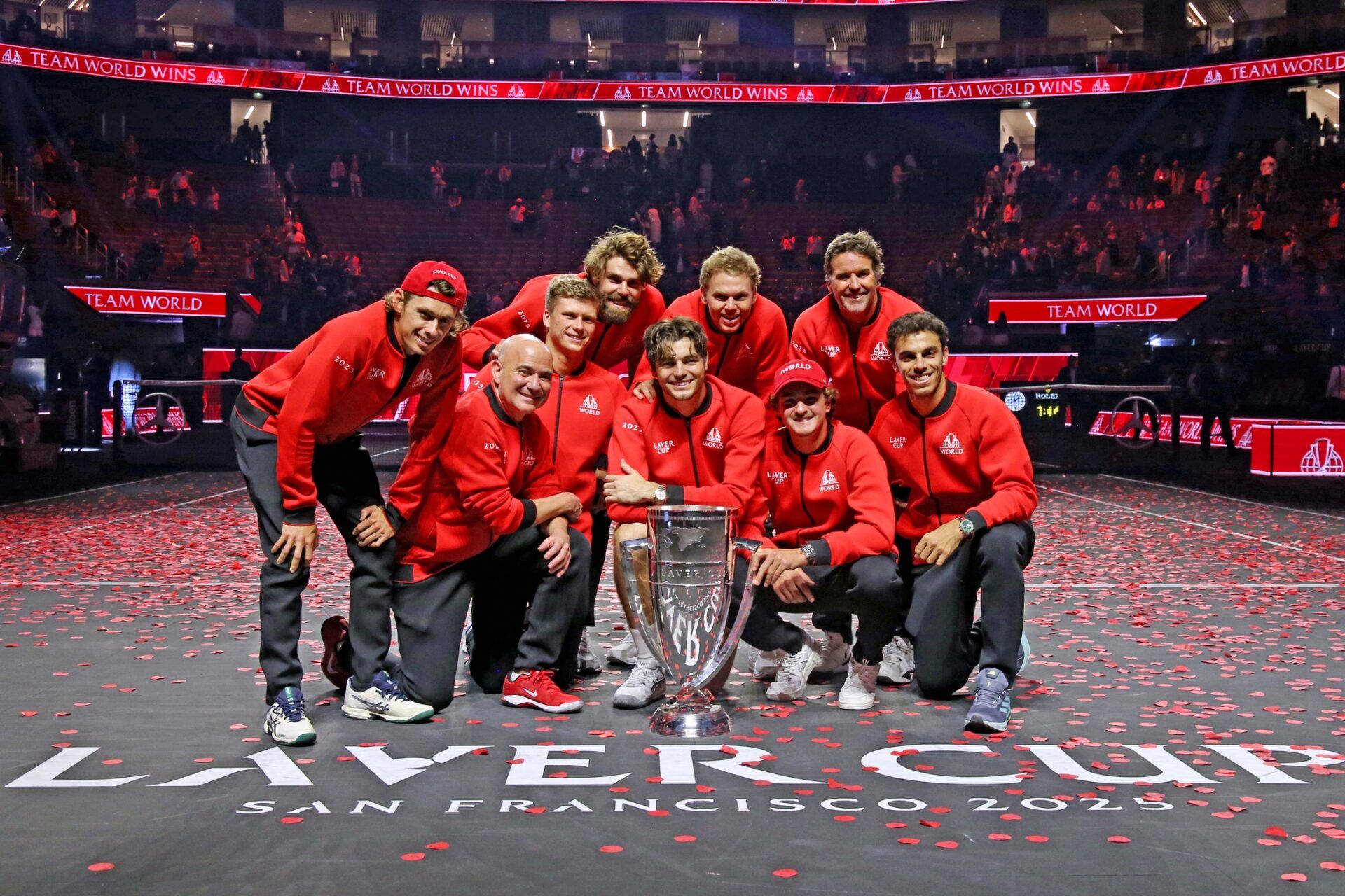 Team Europe player Alex de Menaur, captain Andre Agassi, players Jenson Brooksby, Reilly Opelka, Taylor Fritz, Alex Michelsen, Joao Fonseca, vice captain Patrick Rafter, and player Francisco Cerundulo celebrate with the Laver Cup trophy after defeating Team Europe at the Laver Cup at Chase Center.
