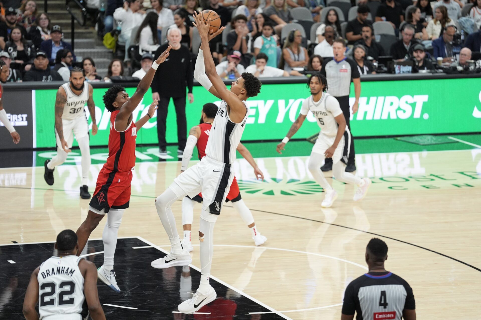 San Antonio Spurs center Victor Wembanyama (1) shoots over Houston Rockets forward Amen Thompson (1) in the second half at Frost Bank Center.