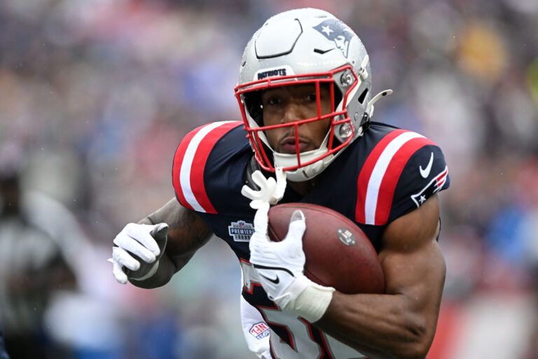 New England Patriots running back TreVeyon Henderson (32) ruswhes the ball against the Las Vegas Raiders in the first half at Gillette Stadium.
