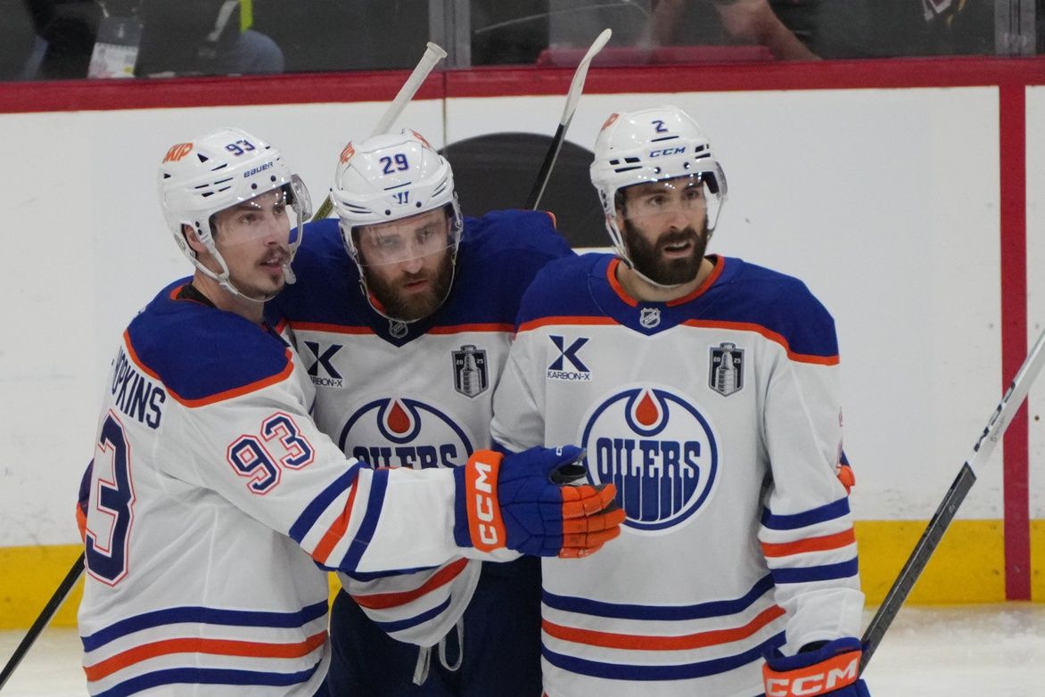 Edmonton Oilers center Ryan Nugent-Hopkins (93) celebrates scoring with center Leon Draisaitl (29) and defenseman Evan Bouchard (2) during the second period against the Florida Panthers  in game four of the 2025 Stanley Cup Final at Amerant Bank Arena.