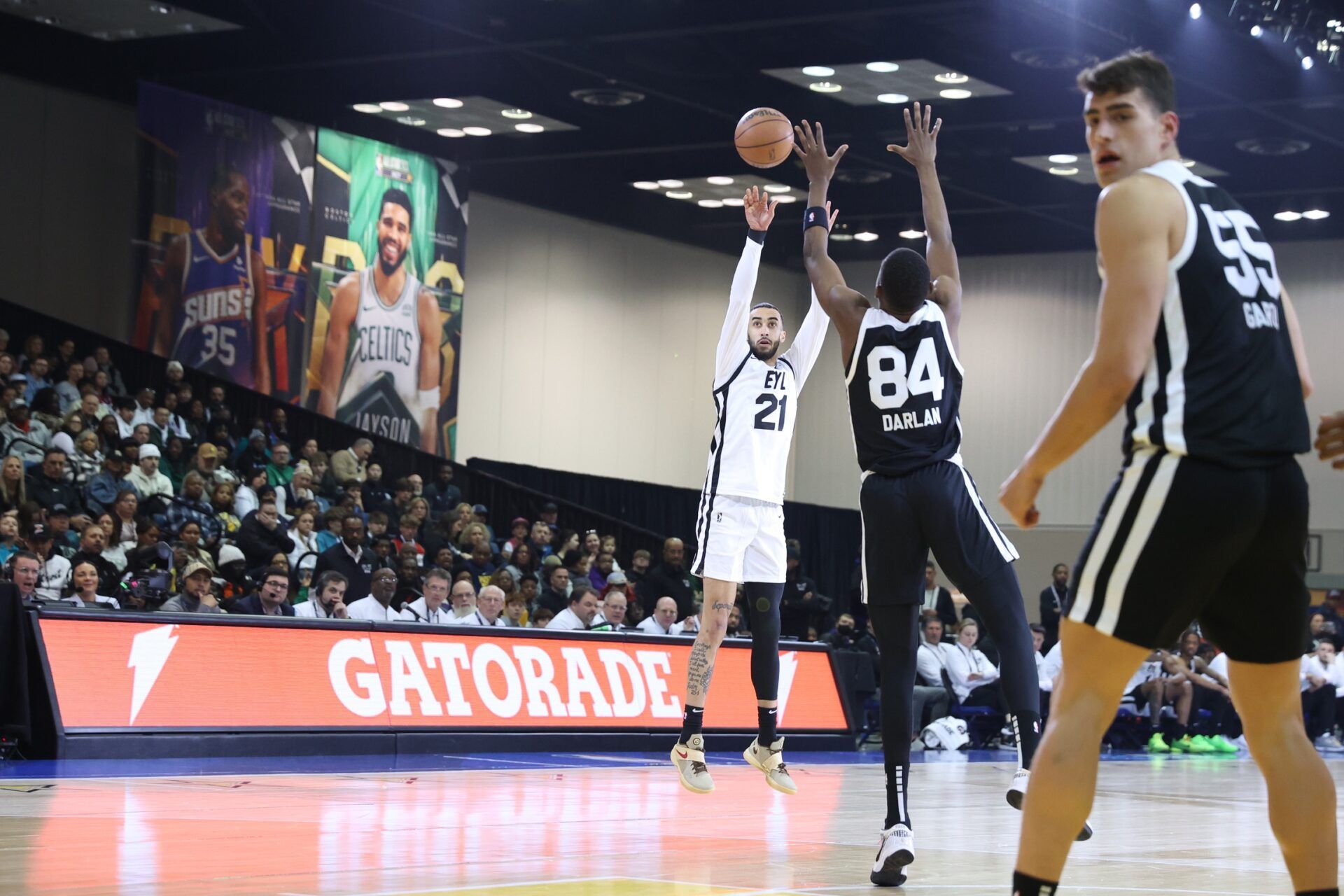 Team ELY guard Trevelin Queen (21) of the Osceola Magic shoots the ball over Team Stricly guard Thierry Darlan (84) of the G League Ignite during the G-League Next Up game at Indiana Convention Center.