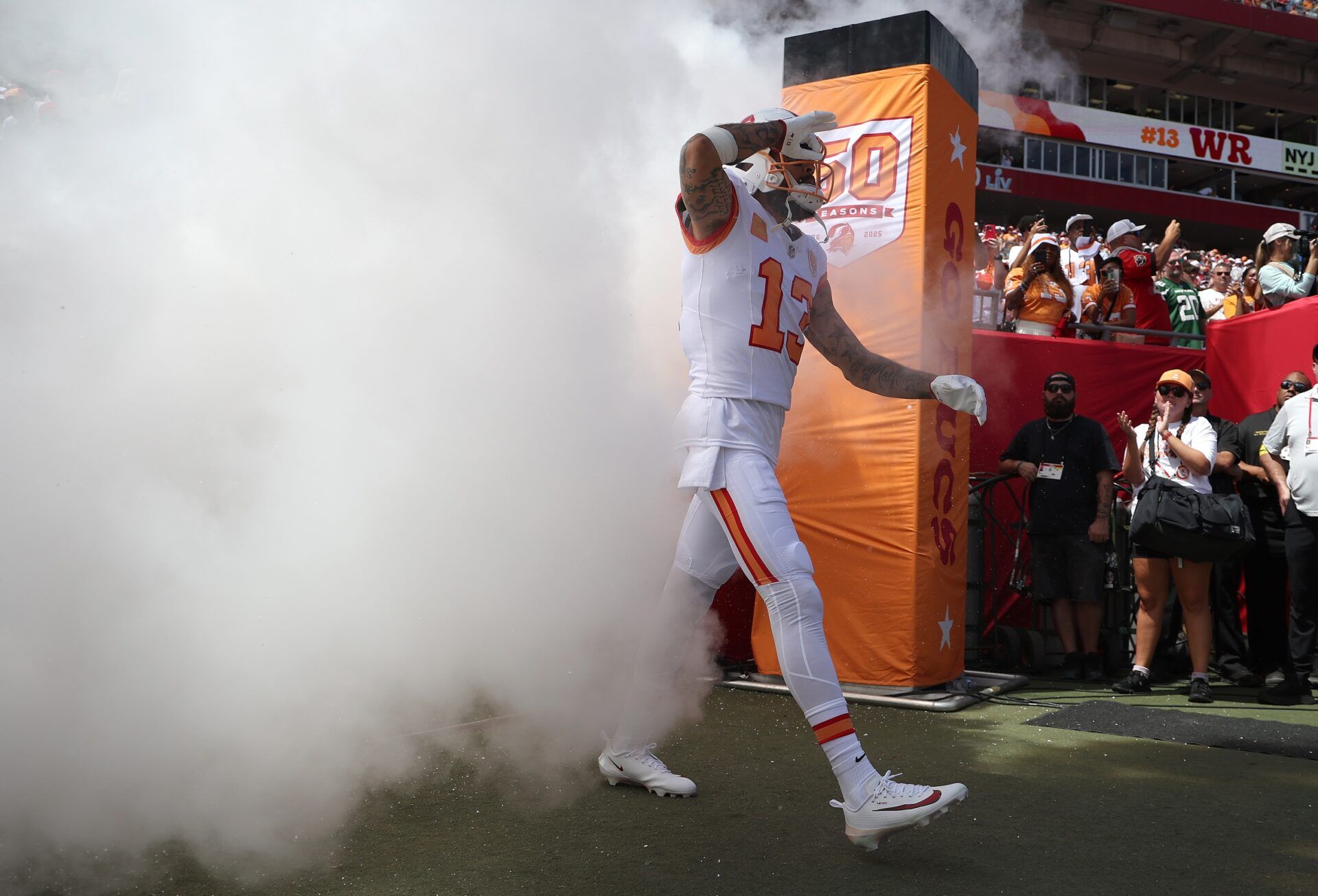Tampa Bay Buccaneers wide receiver Mike Evans (13) runs out of the tunnel prior to the game against the New York Jets at Raymond James Stadium.