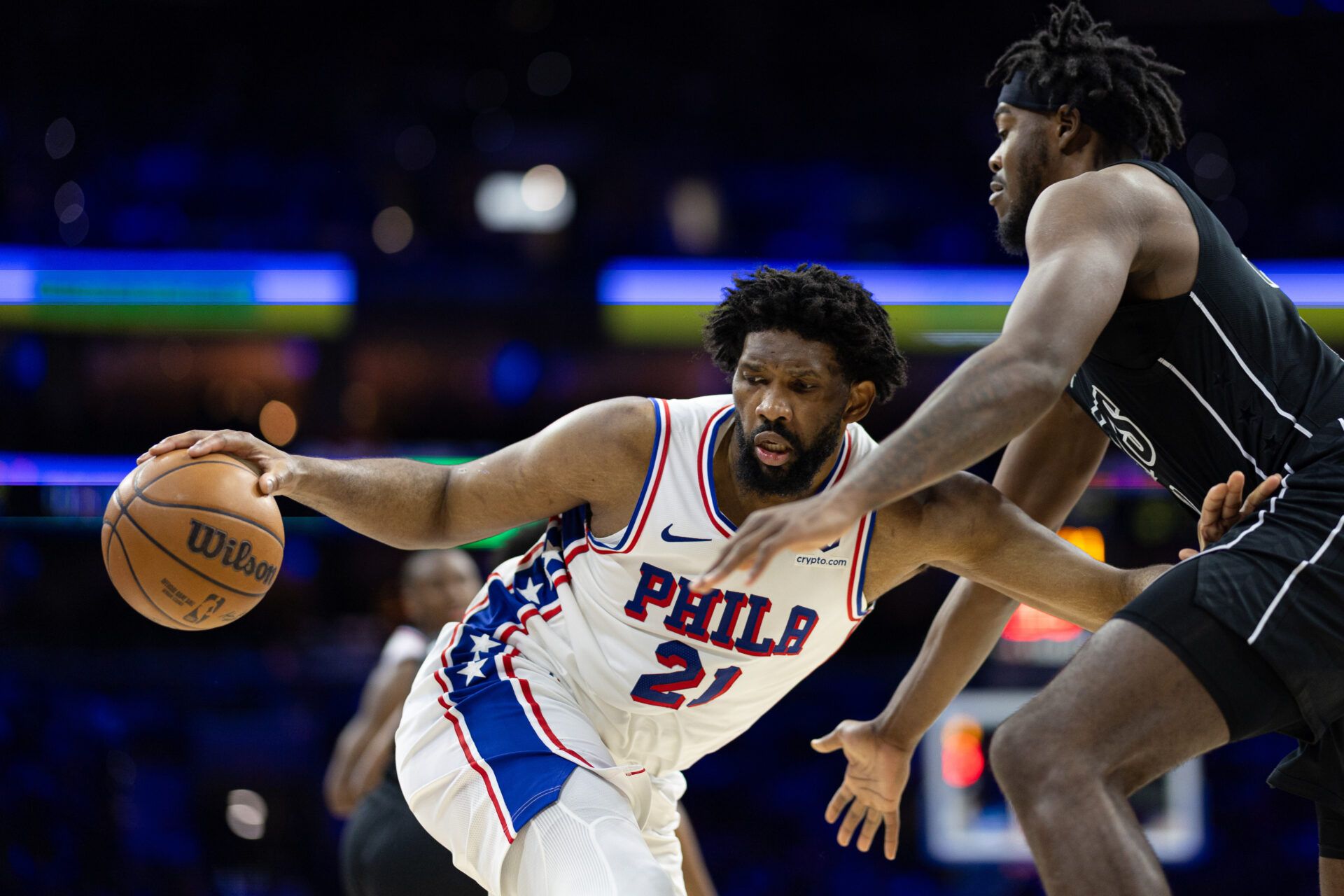 Philadelphia 76ers center Joel Embiid (21) controls the ball against Brooklyn Nets center Day'Ron Sharpe (20) during the third quarter at Wells Fargo Center.