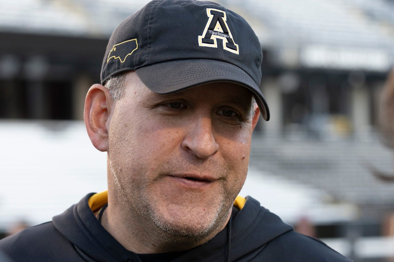 Head Coach Shawn Clark speaks to reporters after the AppState MountaineersÕ football practice at Appalachian State University in Boone, NC, on Wednesday, Oct. 23, 2024.