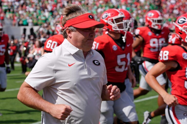 Georgia coach Kirby Smart takes the field with his team before the start of a NCAA college football game against Marshall in Athens, Ga., on Saturday, August. 30, 2025.