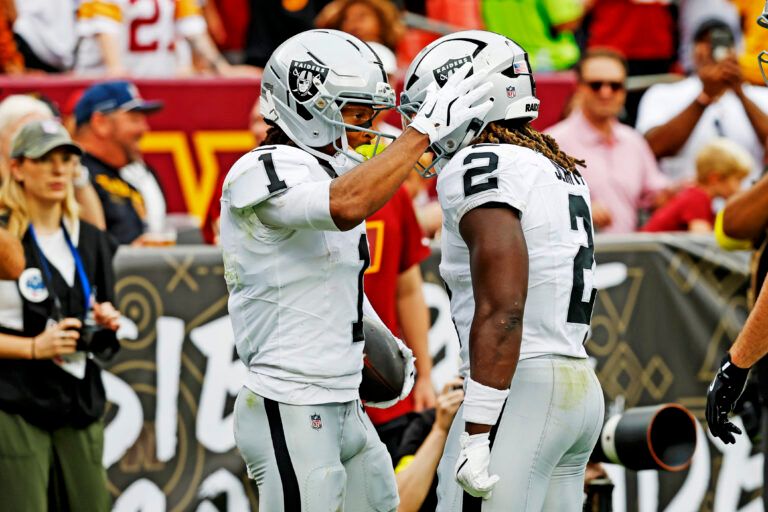Las Vegas Raiders wide receiver Tre Tucker (1) celebrates with Las Vegas Raiders running back Ashton Jeanty (2) after scoring a touchdown during the second half against the Washington Commanders at Northwest Stadium.