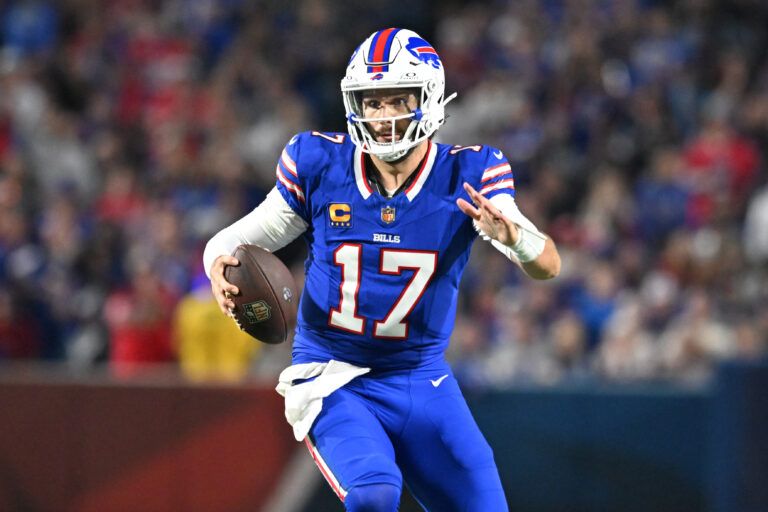 Buffalo Bills quarterback Josh Allen (17) runs against the Miami Dolphins in the second half at Highmark Stadium.