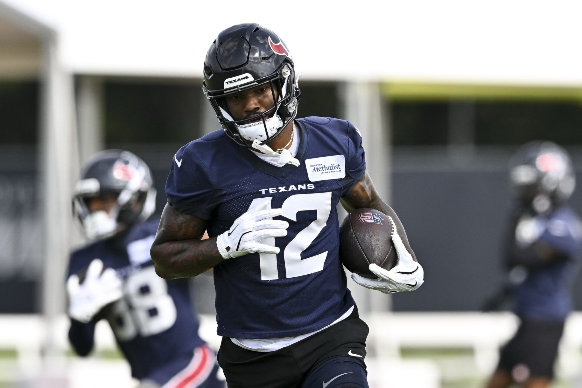 Houston Texans wide receiver Nico Collins (12) participates in a drill during an NFL football minicamp at NRG Stadium.