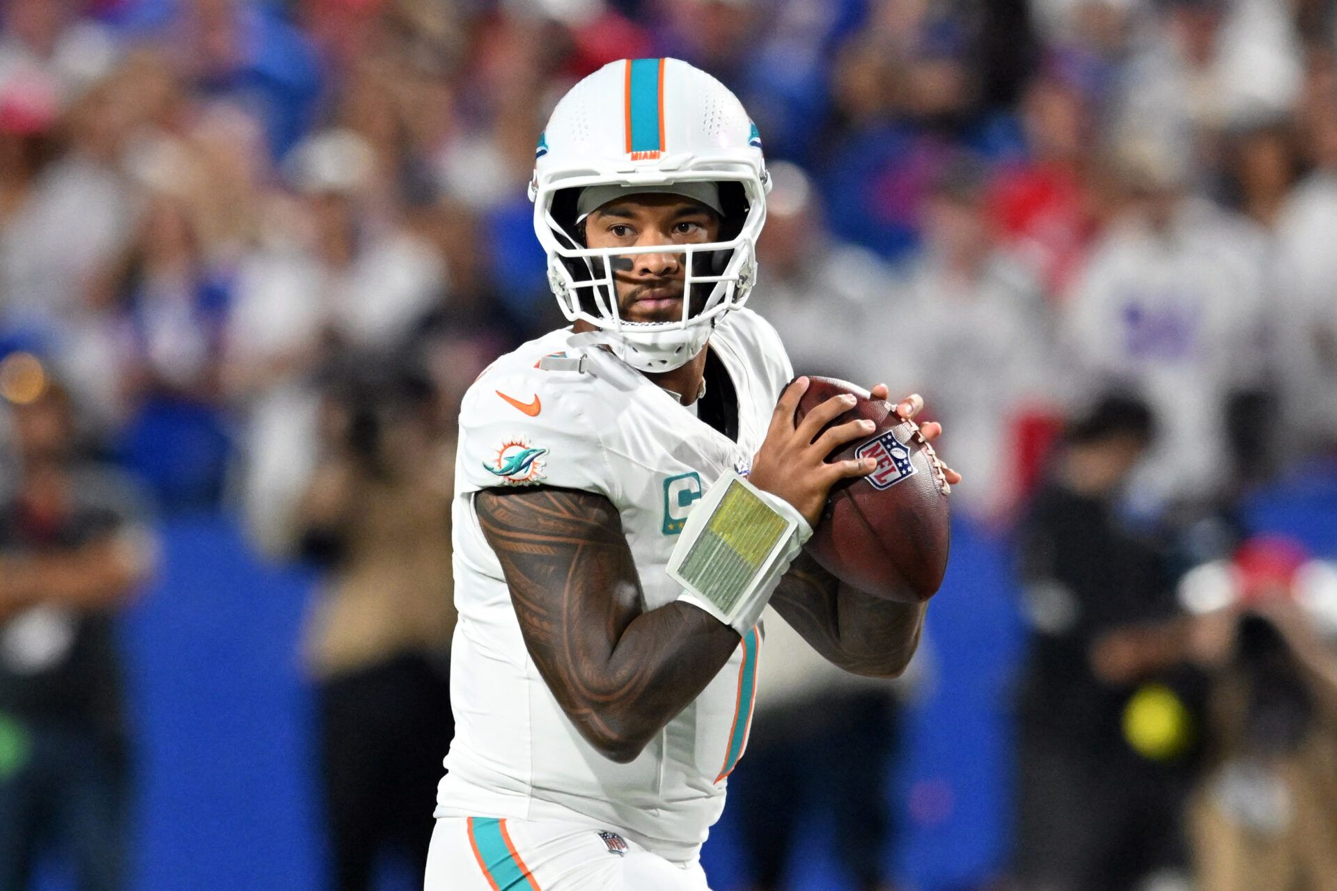 Miami Dolphins quarterback Tua Tagovailoa (1) looks to pass in the first half against the Buffalo Bills at Highmark Stadium.