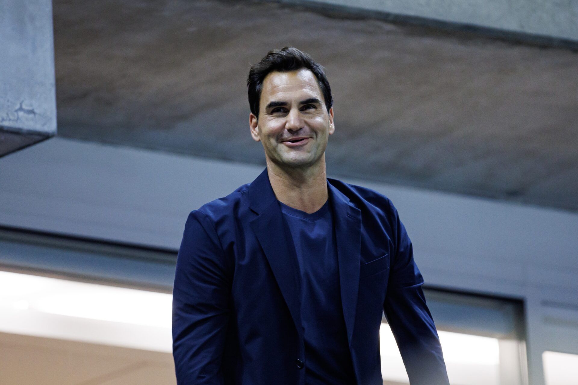 Roger Federer watches Aryna Sabalenka of Russia playing Qinwen Zheng of China on day nine of the U.S. Open tennis tournament at the USTA Billie Jean King National Tennis Center.
