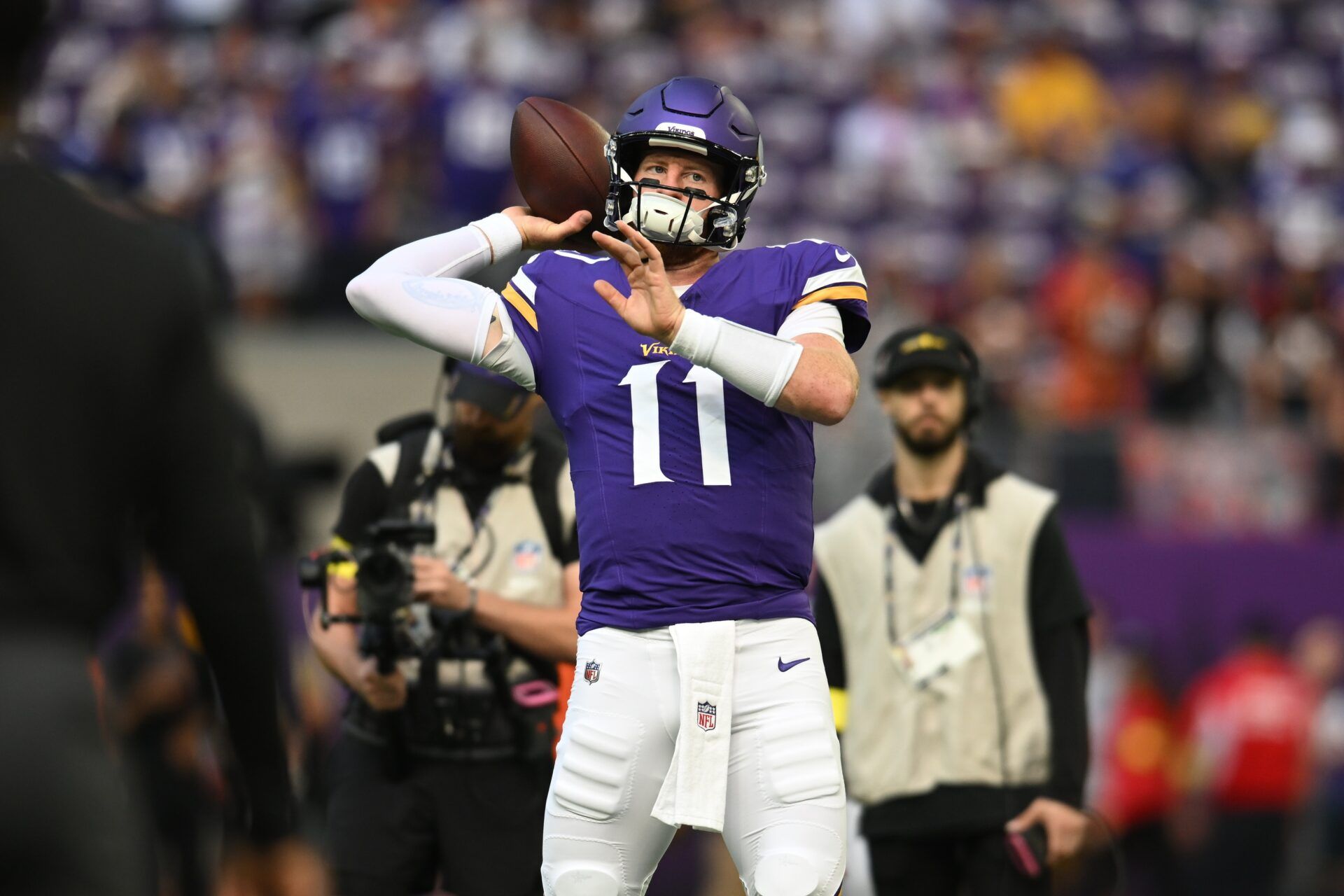 Minnesota Vikings quarterback Carson Wentz (11) warms up prior to a game against the Cincinnati Bengals at U.S. Bank Stadium.