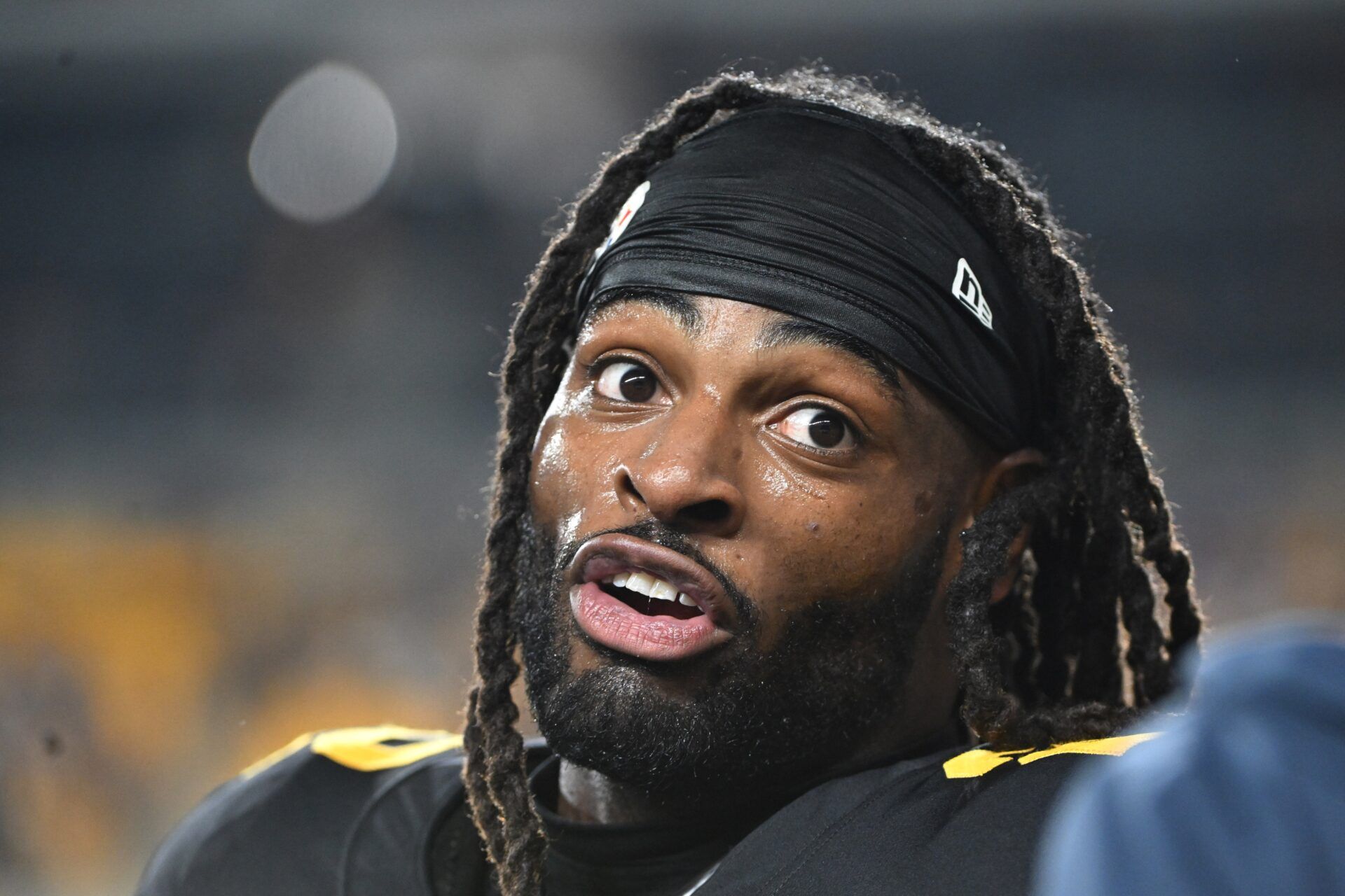Pittsburgh Steelers running back Najee Harris (22) talks with a fan against the New York Giants during the first quarter at Acrisure Stadium.
