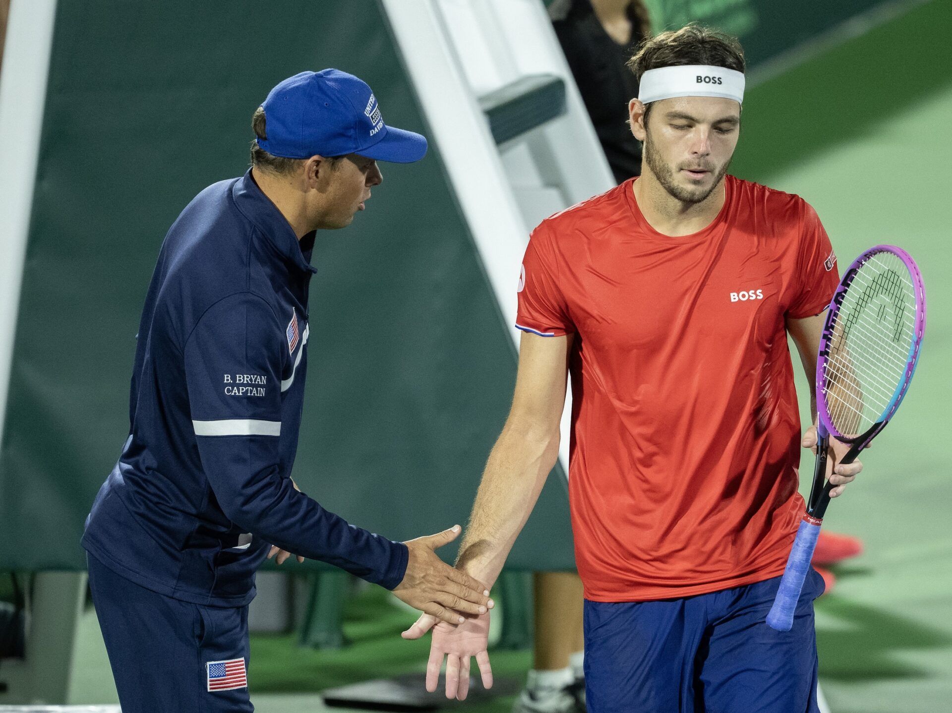 Taylor Fritz of the United States and Team Captain, Bob Bryan react agains Jakub Mensik of Czechia in the second rubber of the Davis Cup tie between the USA and Czechia at Delray Beach Tennis Center.