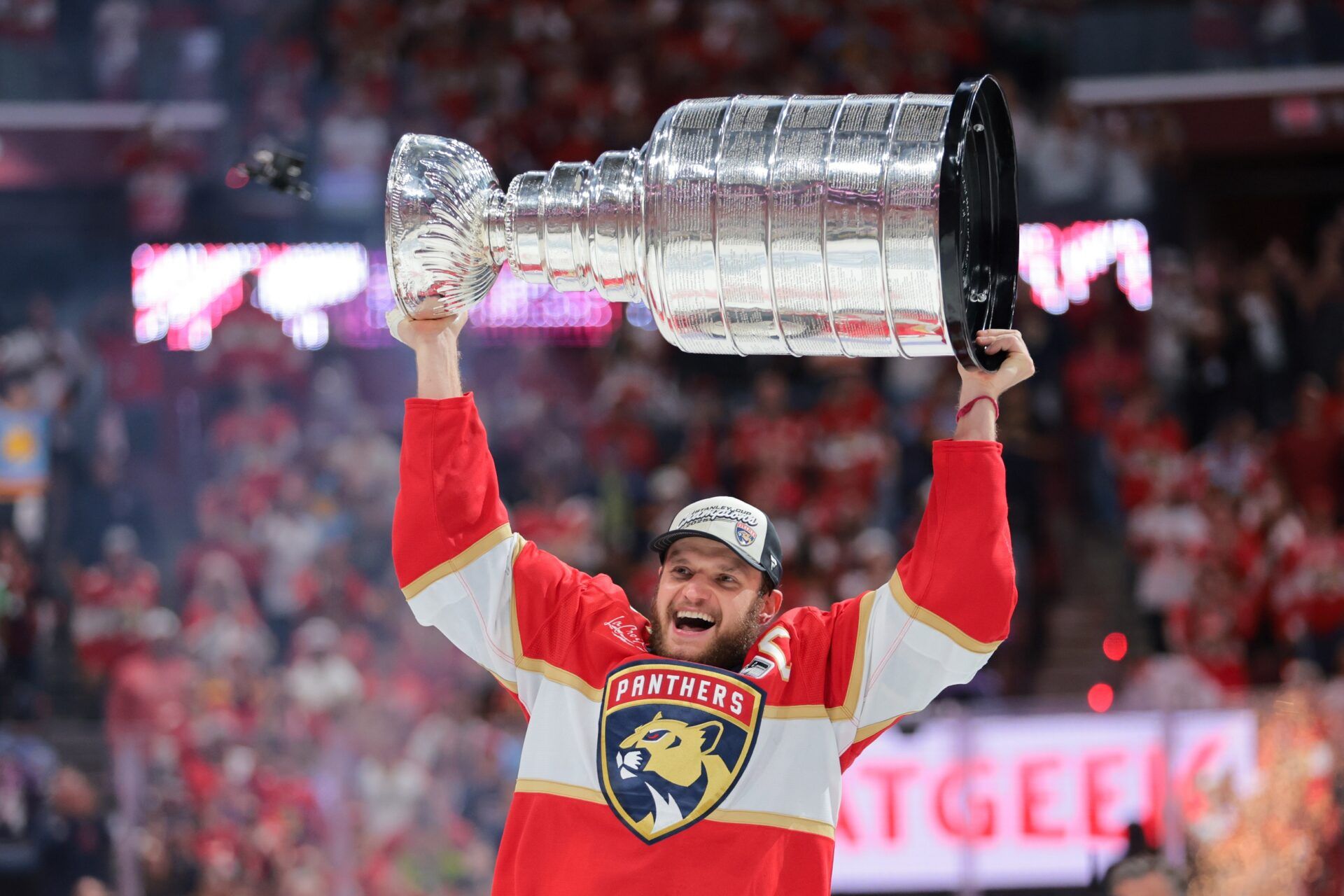 Florida Panthers center Aleksander Barkov (16) hoists the Stanley Cup after winning game six of the 2025 Stanley Cup Final against the Edmonton Oilers at Amerant Bank Arena.