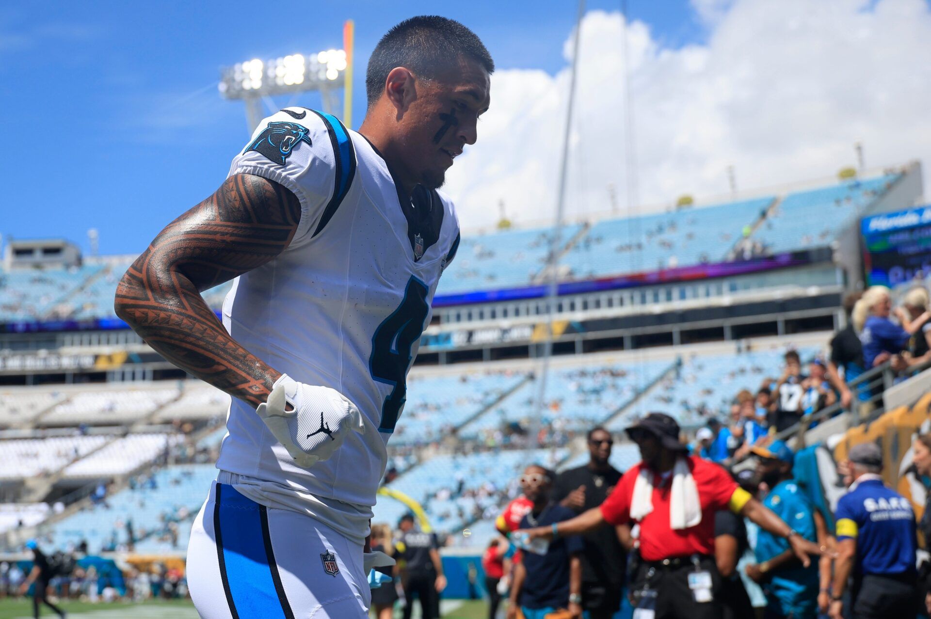 Carolina Panthers wide receiver Tetairoa McMillan (4) runs off the field before an NFL football matchup at EverBank Stadium, Sunday, Sept. 7, 2025 in Jacksonville, Fla. [Corey Perrine/Florida Times-Union]