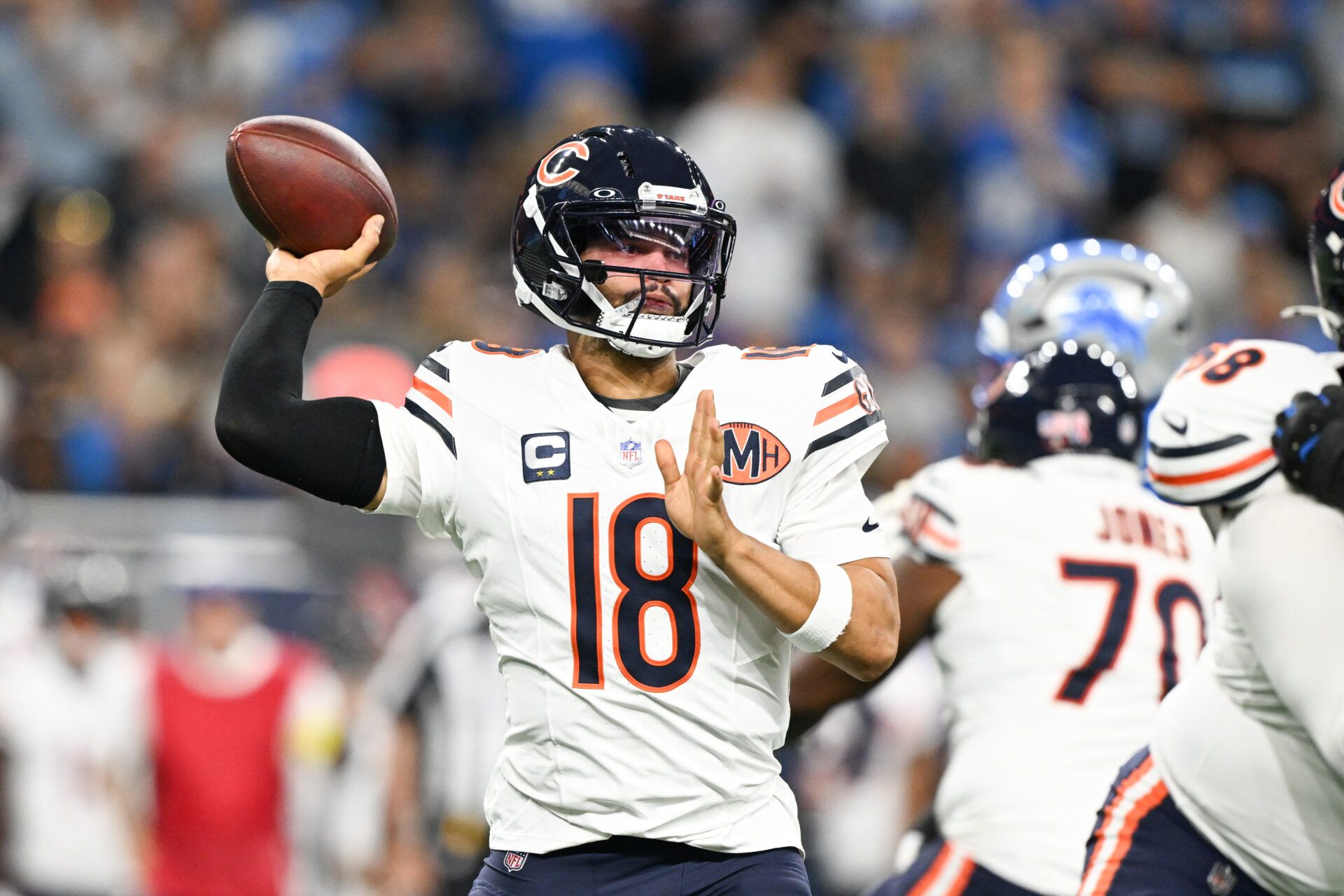 Chicago Bears quarterback Caleb Williams (18) passes the ball against the Detroit Lions during the first quarter of the game at Ford Field.