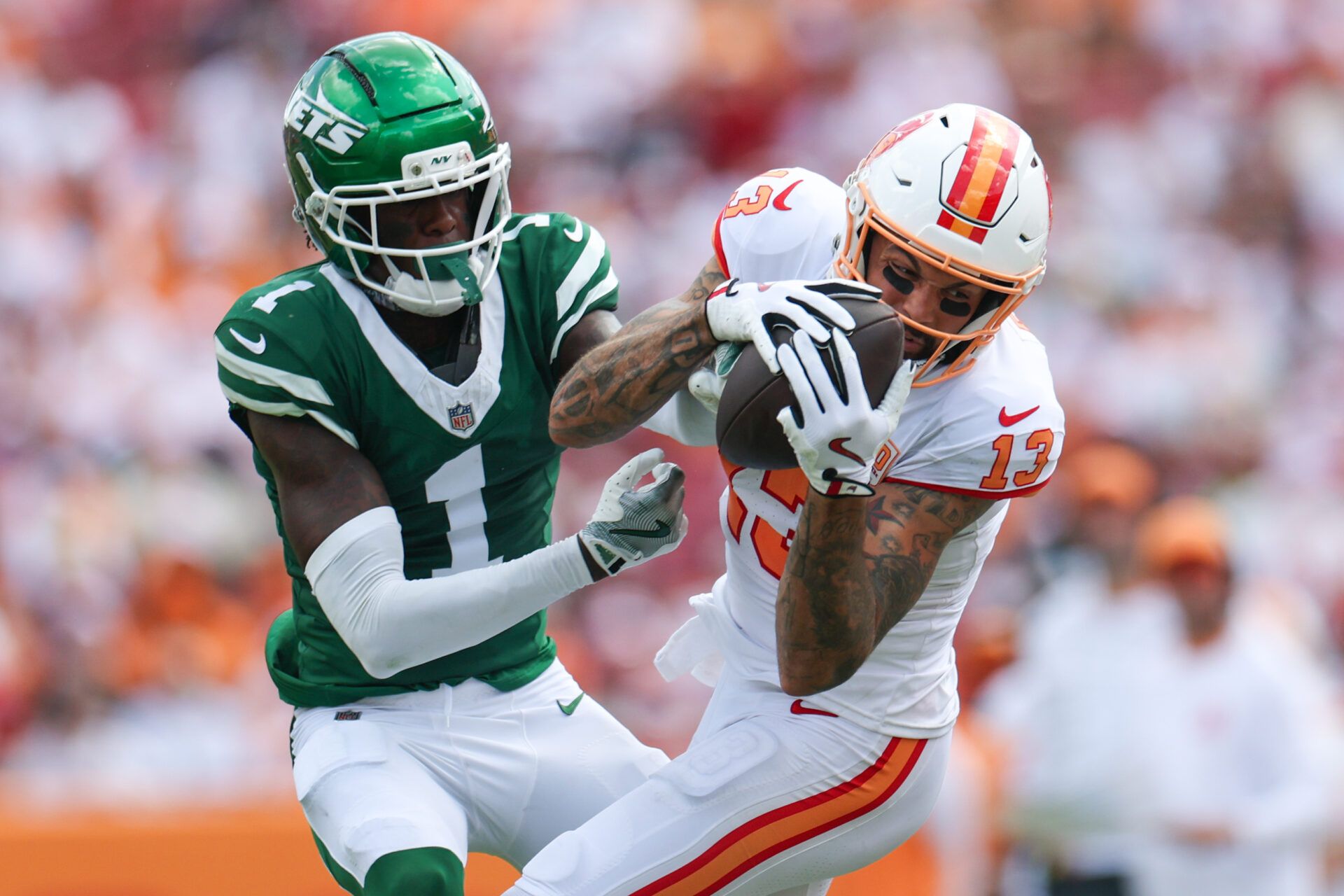 Tampa Bay Buccaneers wide receiver Mike Evans (13) catches pass defended boy New York Jets cornerback Sauce Gardner (1) in the third quarter at Raymond James Stadium.
