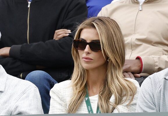 Social media influencer and girlfriend of Tommy Paul (USA)(not pictured), Paige Lorenzo (R), watches from the stands during Paul's gentlemen's singles match against Otto Virtanen (FIN)(not pictured) in a on day three of The Championships Wimbledon 2024 at All England Lawn Tennis and Croquet Club.
