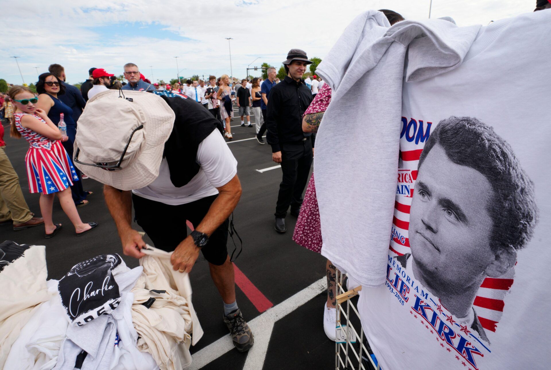 Charlie Kirk merch sells at a street vendor’s spot prior to memorial for Charlie Kirk at State Farm Stadium in Glendale, Ariz. on Sept. 20, 2025.