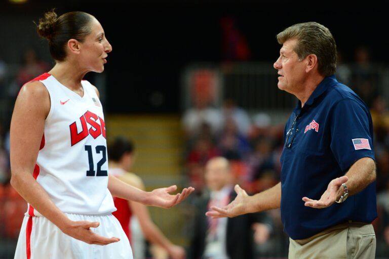 USA guard Diana Taurasi (12) and USA head coach Geno Auriemma (right) talk in the second half of a preliminary round group A game during the London 2012 Olympic Games at Basketball Arena. USA defeated Turkey 89-58.