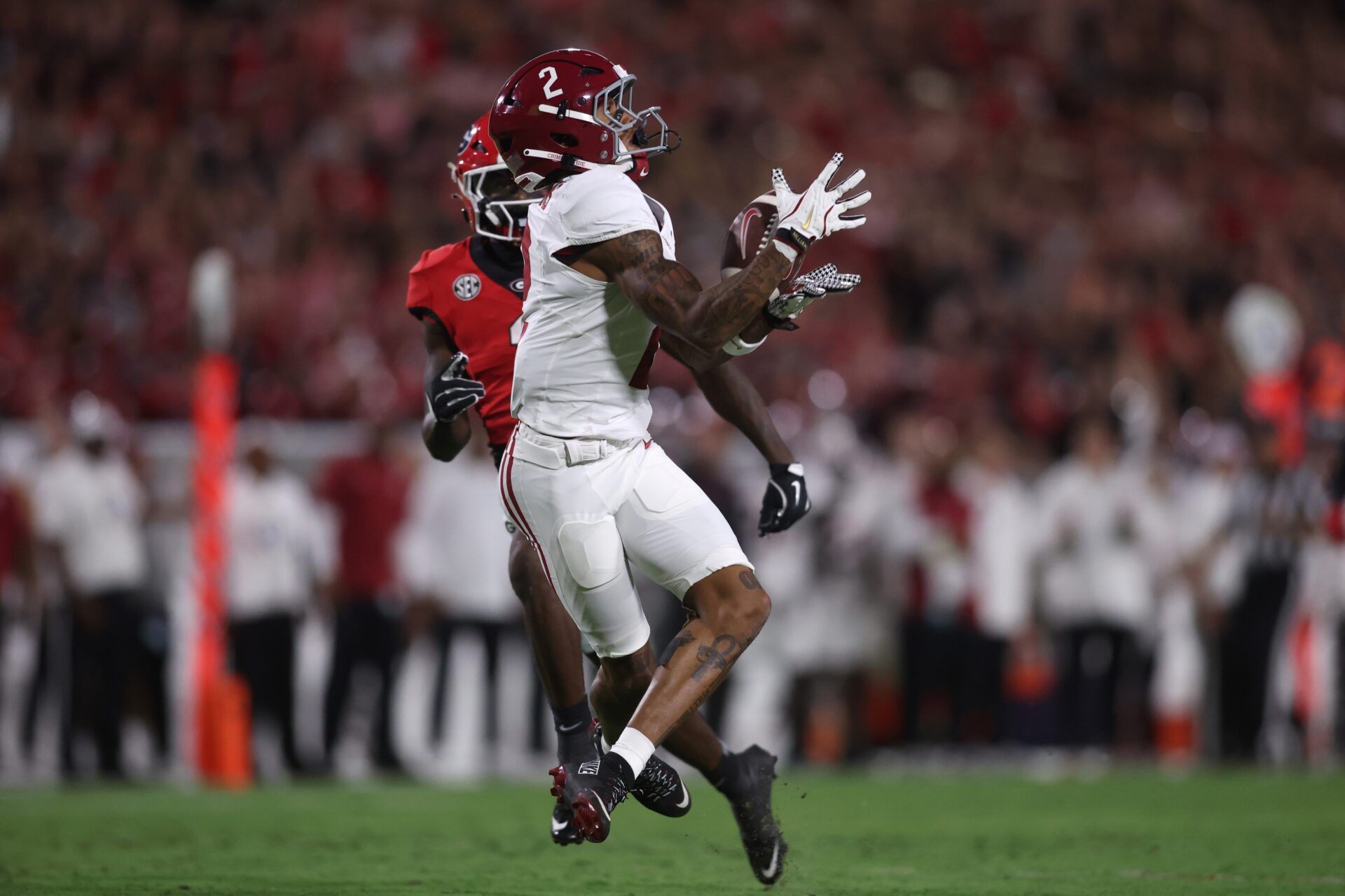 Alabama Crimson Tide wide receiver Ryan Williams (2) drops a pass against Georgia Bulldogs wide receiver Zachariah Branch (1) in the first quarter at Sanford Stadium.
