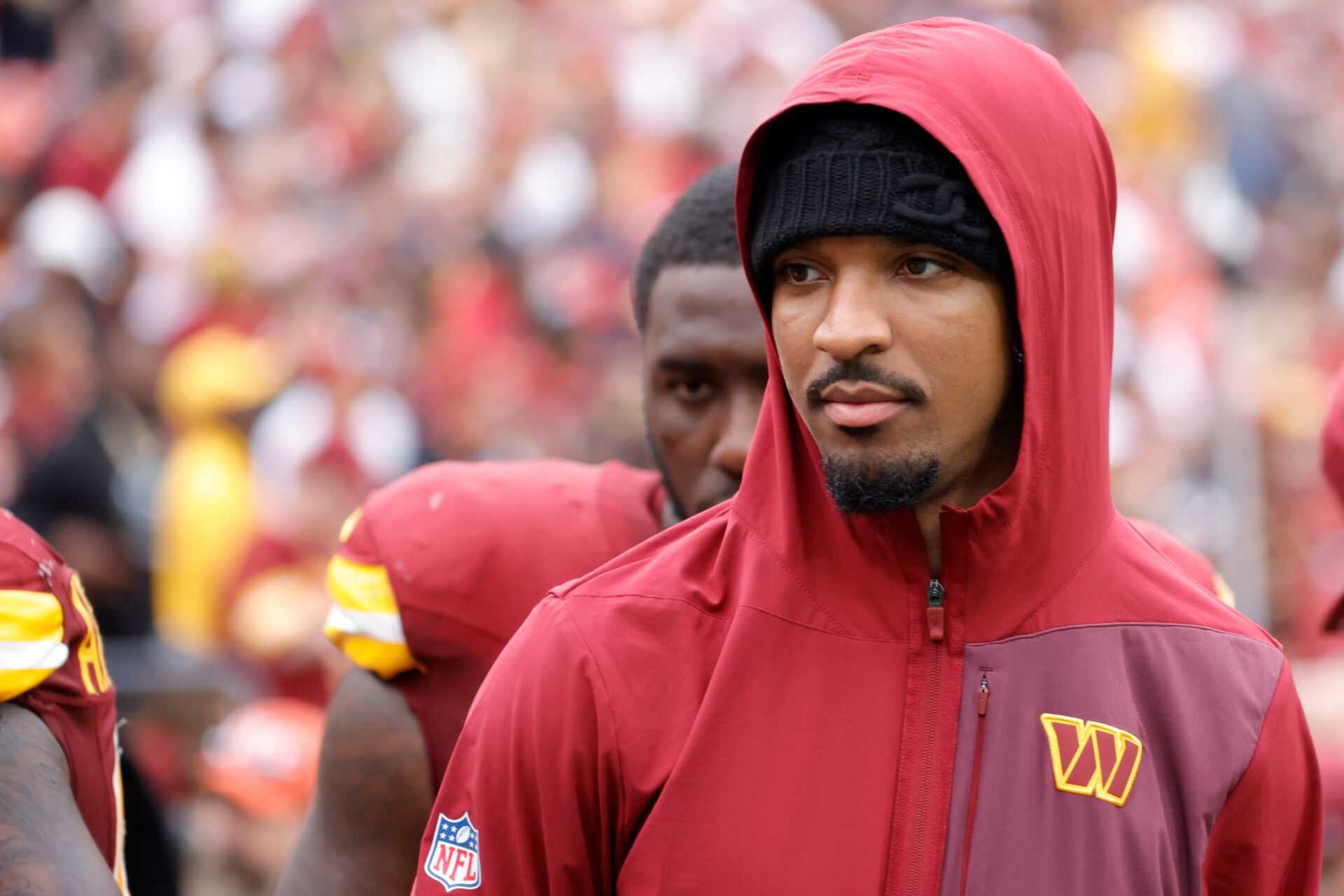 Injured Washington Commanders quarterback Jayden Daniels  walks off the field after the Commanders' game against the Las Vegas Raiders at Northwest Stadium.