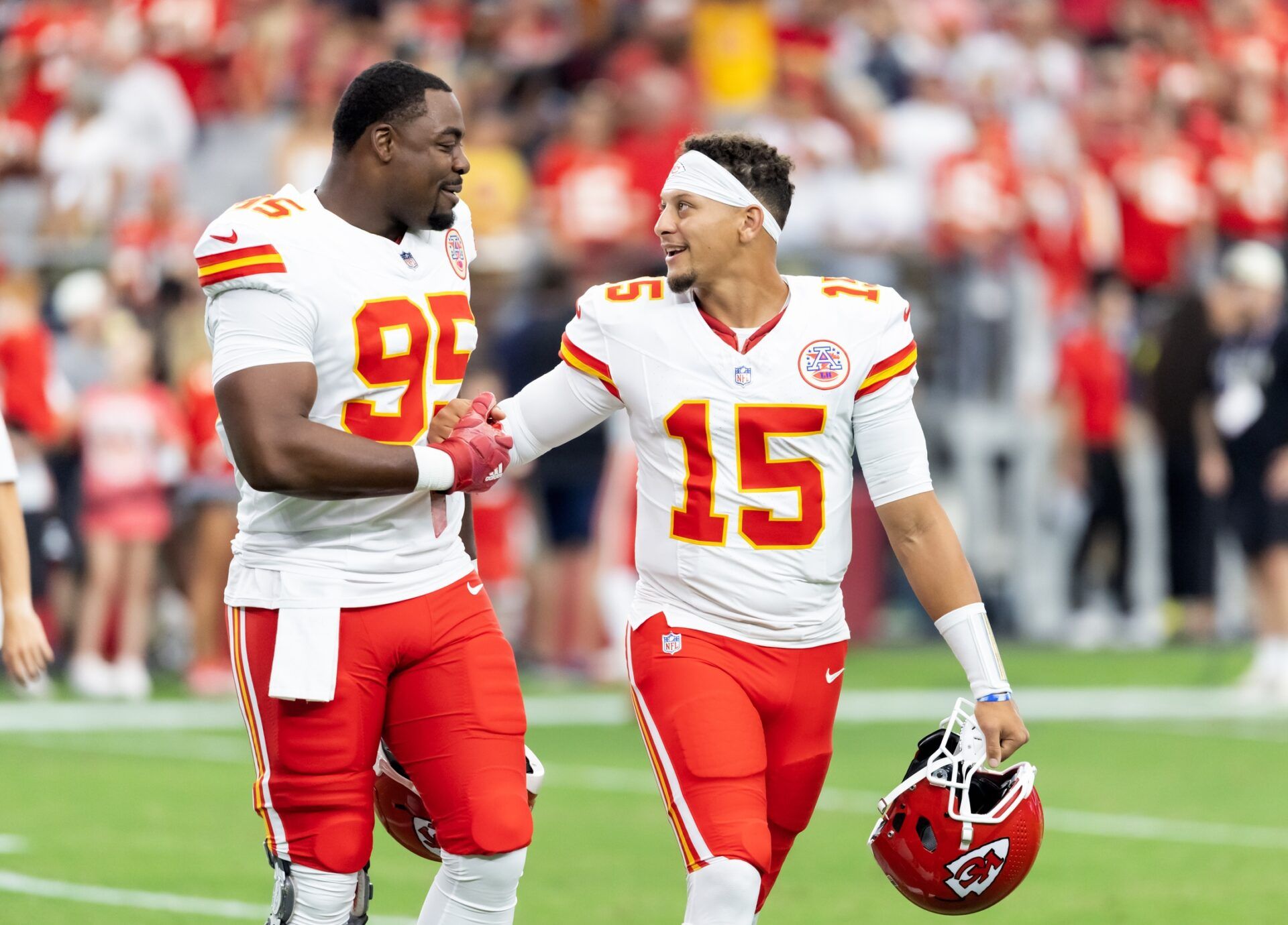 Kansas City Chiefs defensive tackle Chris Jones (95) with quarterback Patrick Mahomes (15) against the Arizona Cardinals during a preseason NFL game at State Farm Stadium.