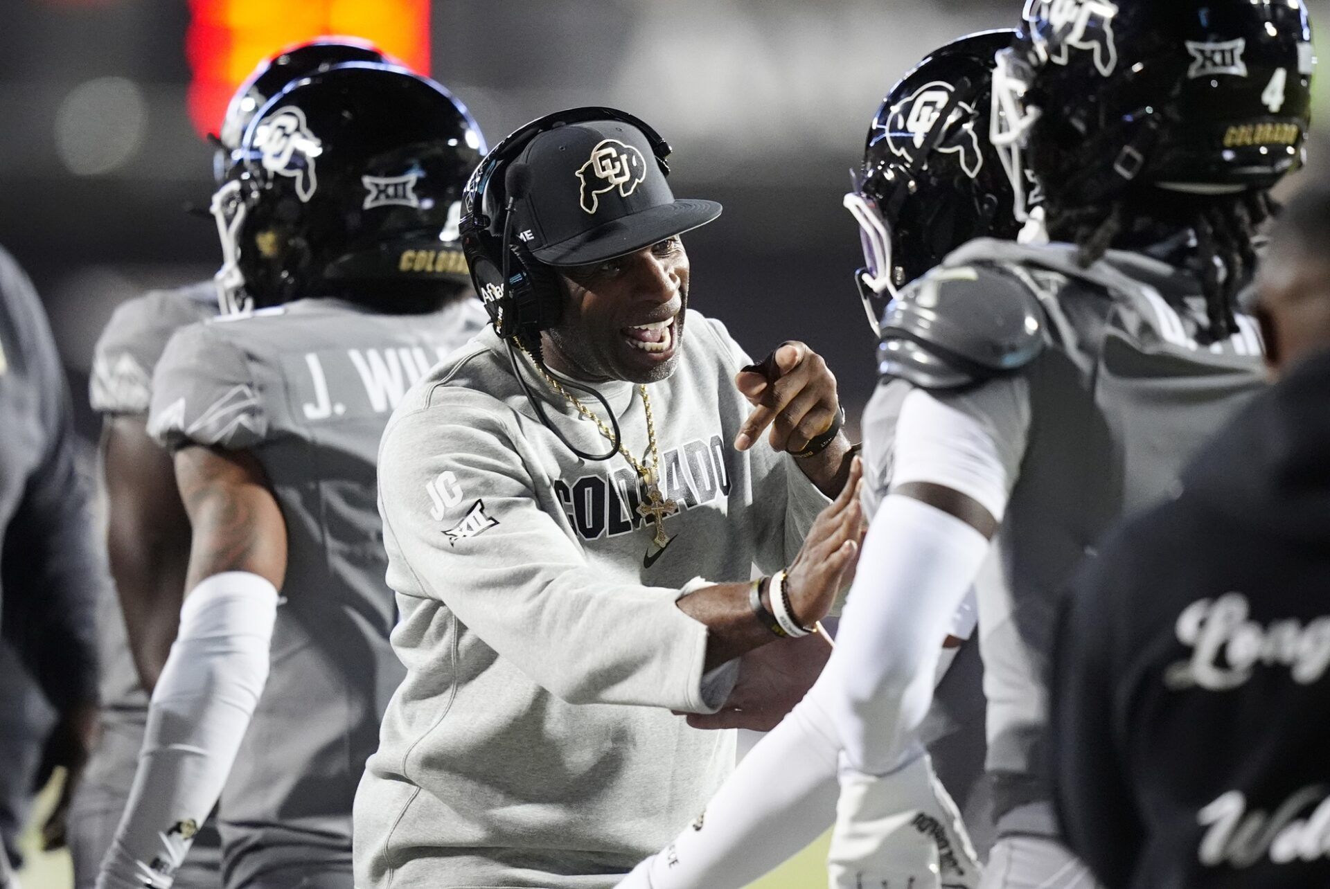 Colorado Buffaloes head coach Deion Sanders reacts to a touchdown scored in the first quarter against the Colorado Buffaloes at Folsom Field.