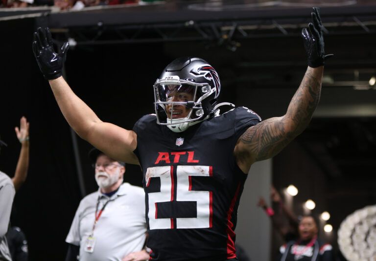 Atlanta Falcons running back Tyler Allgeier (25) celebrates after a touchdown during the second half against the Washington Commanders at Mercedes-Benz Stadium.