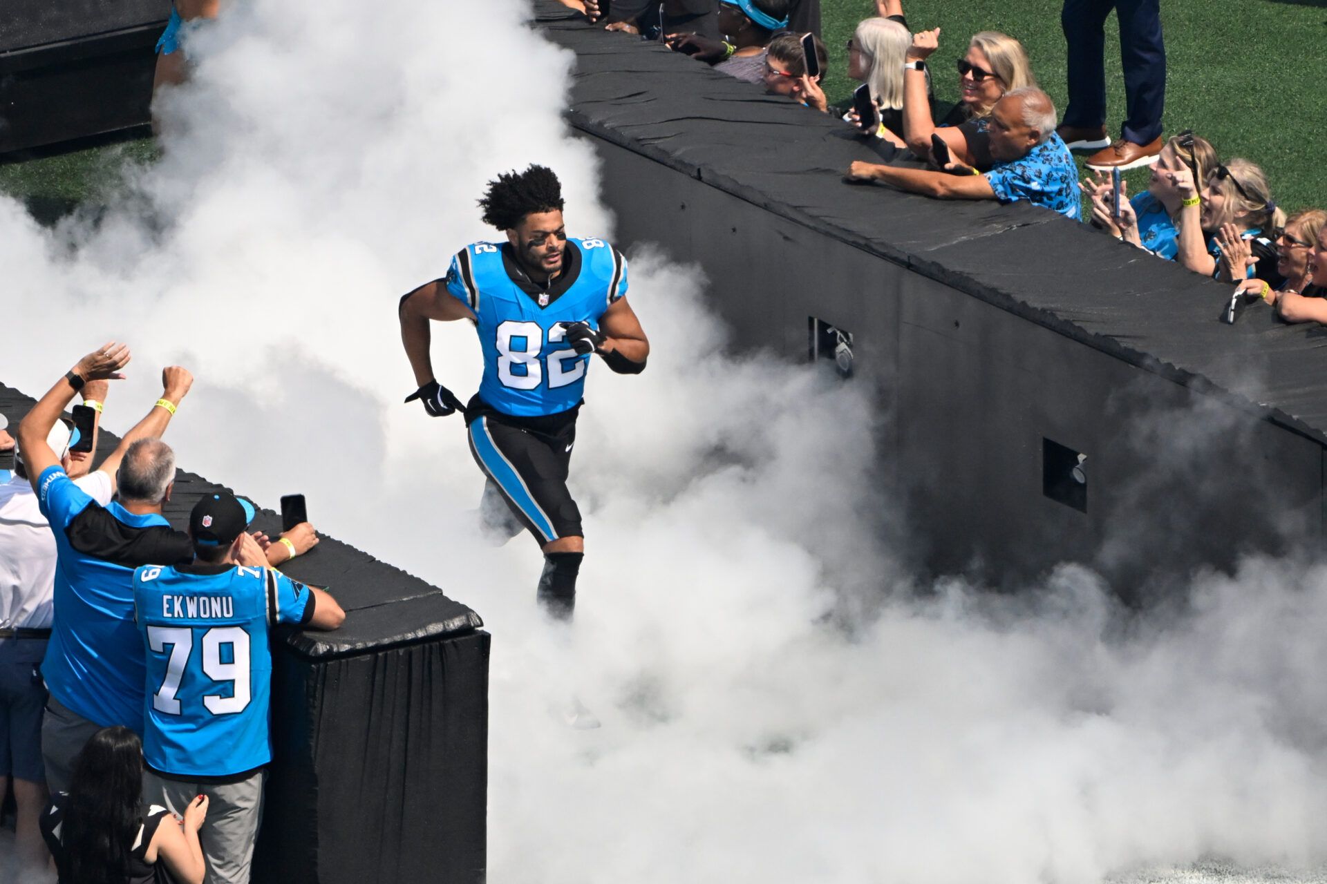 Carolina Panthers tight end Tommy Tremble (82) runs on to the field before the game at Bank of America Stadium.