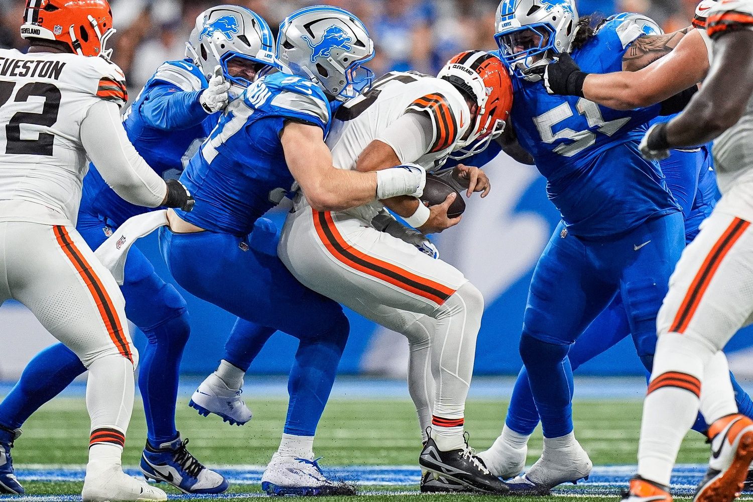 Detroit Lions defensive end Aidan Hutchinson (97) sacked Cleveland Browns quarterback Joe Flacco (15) during the first half at Ford Field in Detroit on Sunday, Sept. 28, 2025.