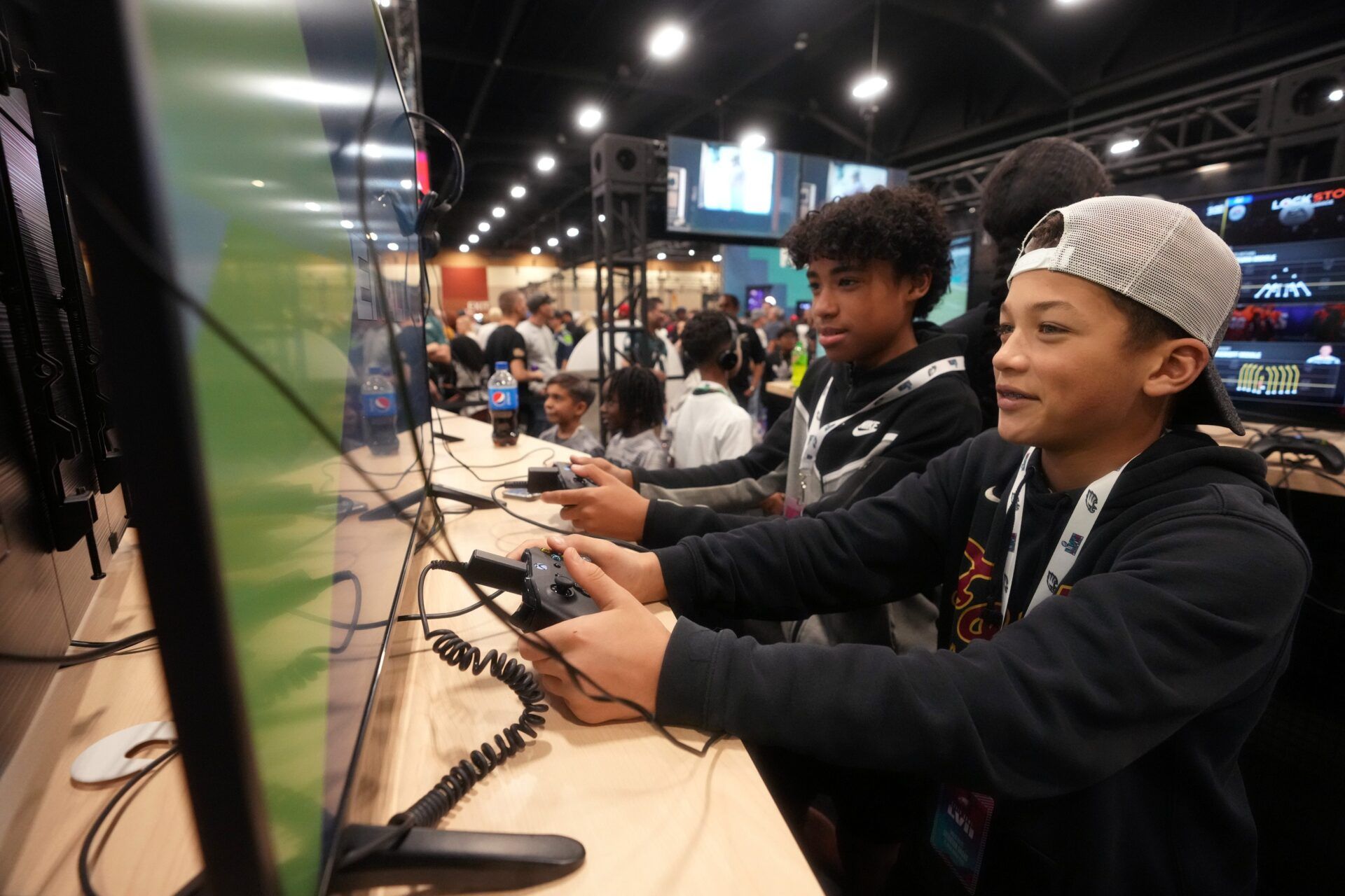 Connor Dodson (right), 14, and Aaden Brady, 13, play Madden video games as fans gather at the Super Bowl LVII Experience at the Phoenix Convention Center on Feb. 11, 2023.

Entertainment Nfl Experience